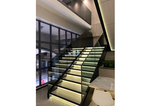 Mild Steel Staircase Structure with Glass Handrail and Titanium Topping